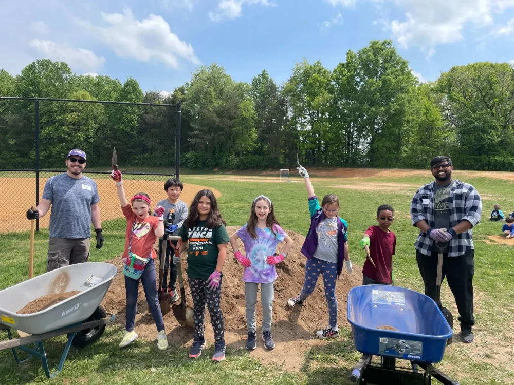 Brightspot volunteers and Aldrin Elementary School children during spring garden beautification event