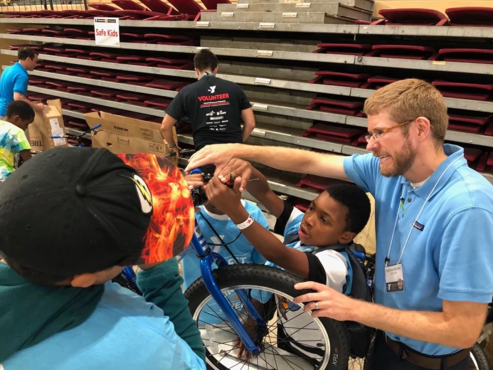 Brightspot employee Matthew Wardian with attendees during the YMCA Thingamajig Invention Convention in Washington, D.C.