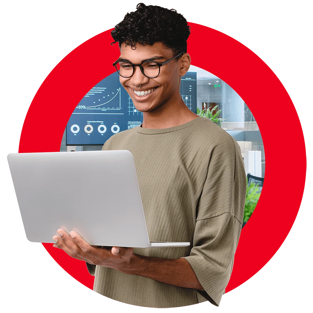 smiling technology persona holding laptop, with Brightspot logo in background