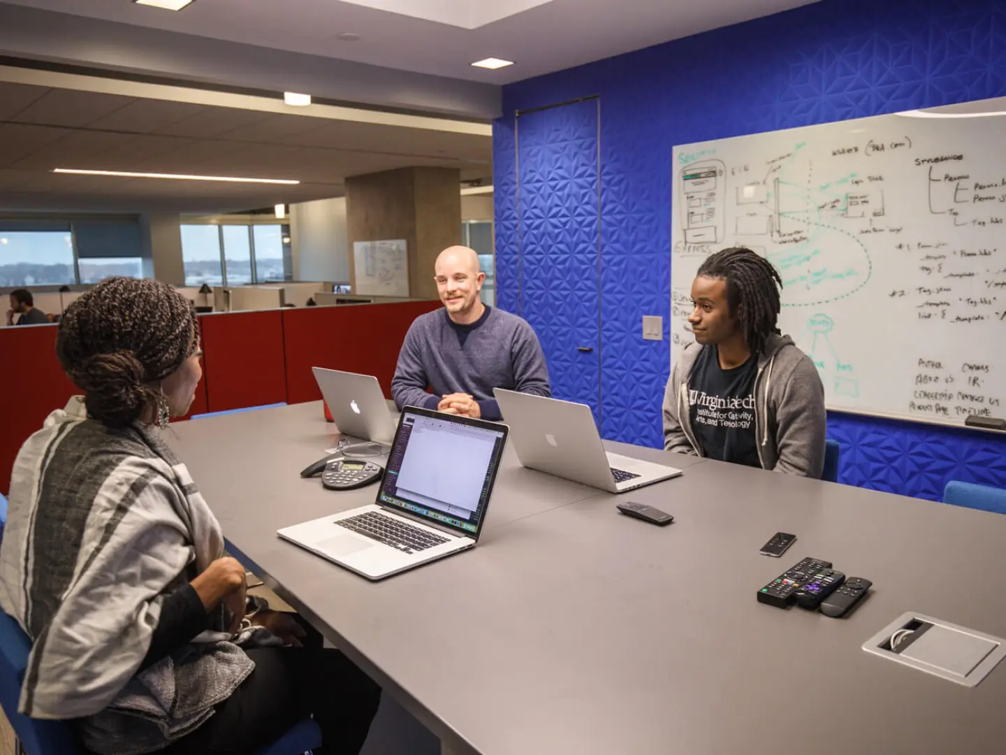 Brightspot employees in a team meeting in Reston office