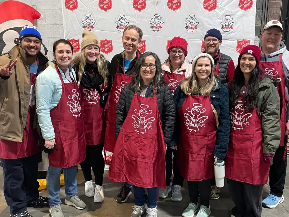 group of Brightspot volunteers at the Salvation Army's Angel Tree warehouse in December 2024