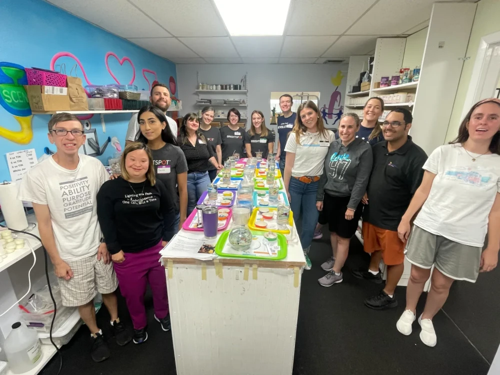 Brightspot volunteers and participants at a candlemaking workshop hosted by ScentsAbility in Fort Lauderdale, FL