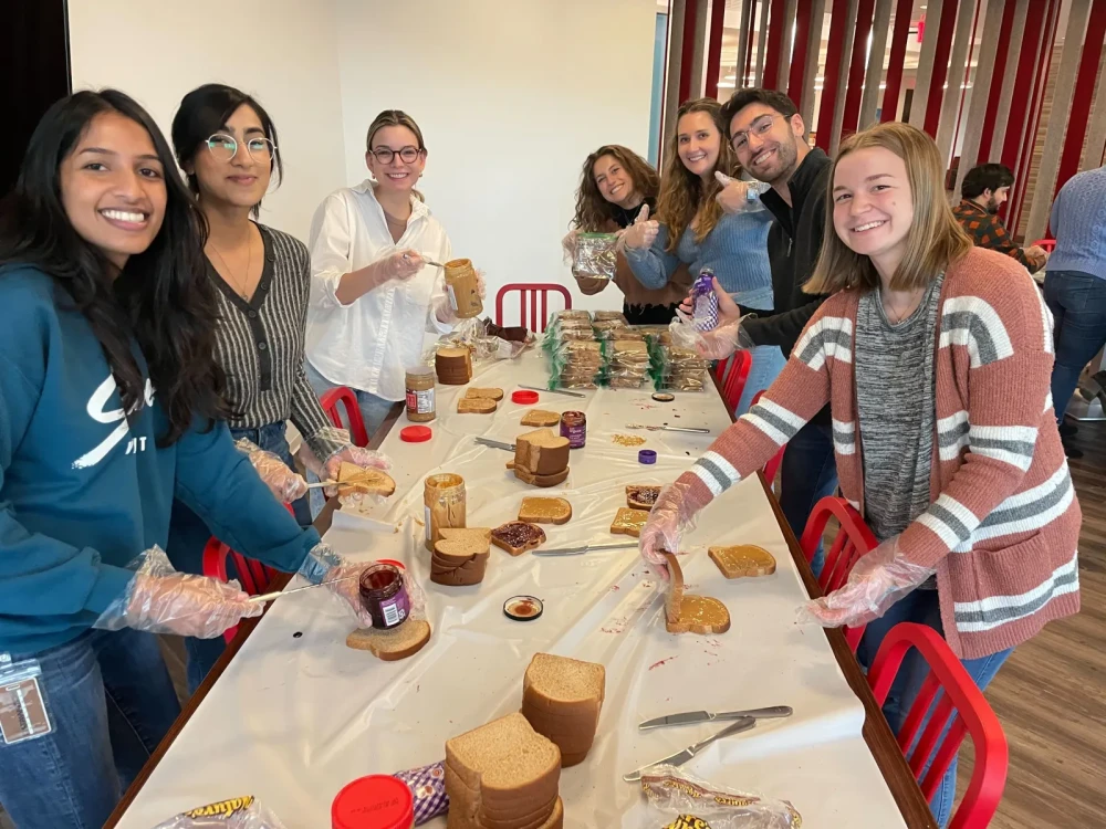 Brightspot employees packing lunches for Cornerstones Embry Rucker Shelter