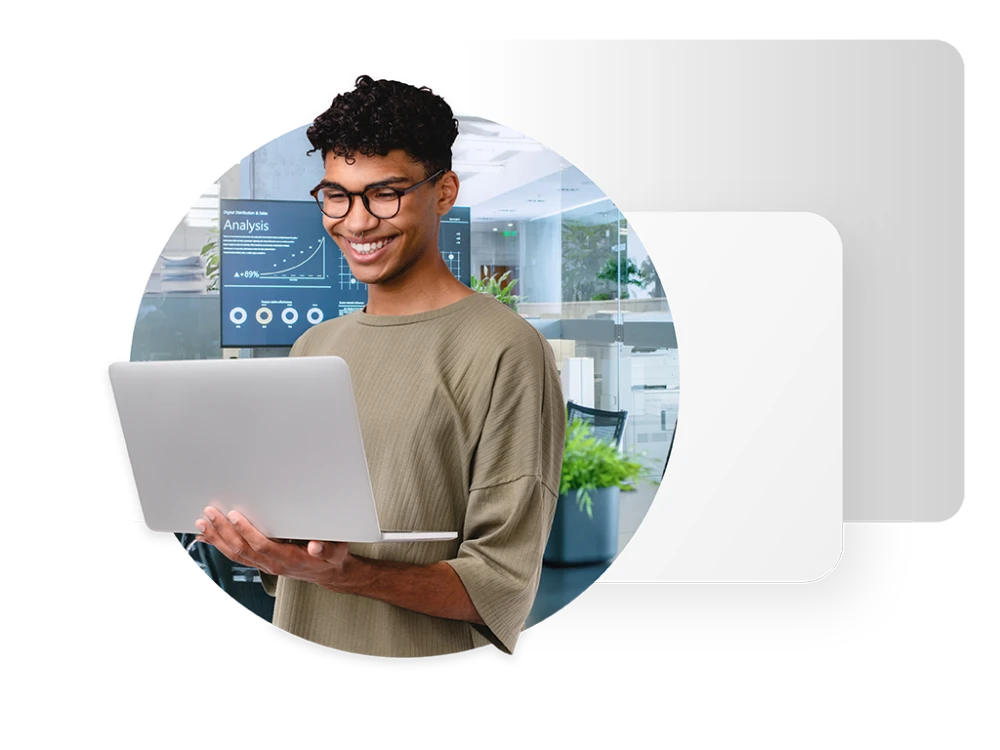 graphic showing male website developer with laptop framed by a circular background image of an office setting